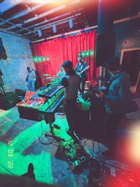 a group of people playing music in a room